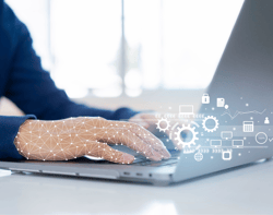  An online retailer working on a laptop and being guided and helped by RPA technology for quick order fulfilment.