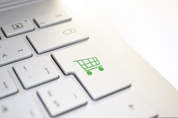 White keyboard with green shopping trolley button